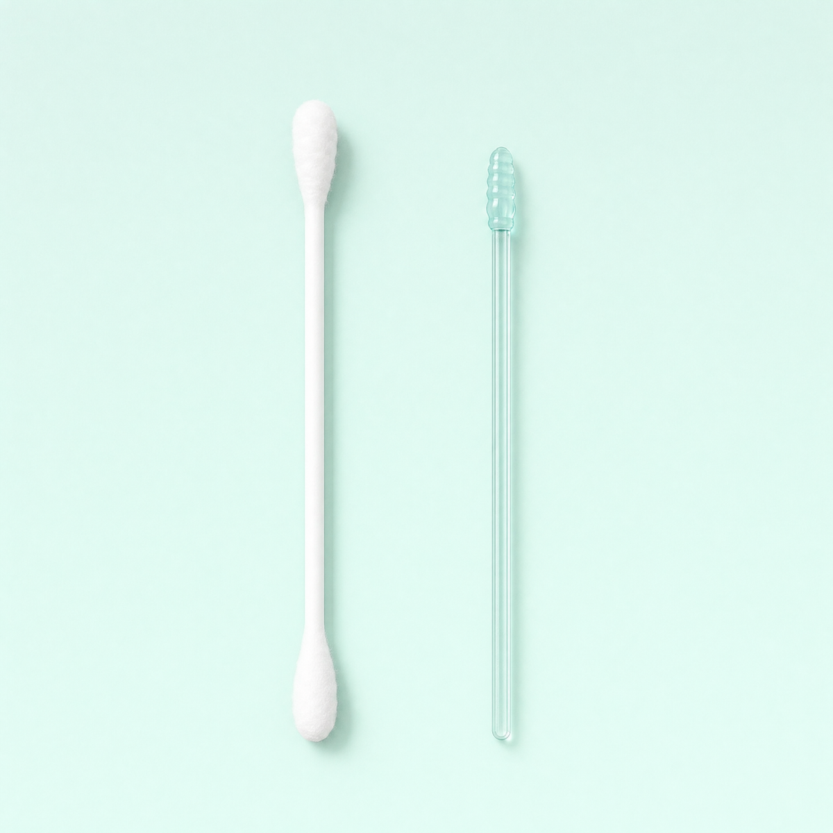 A cotton swab beside an Elariq stick at the same scale